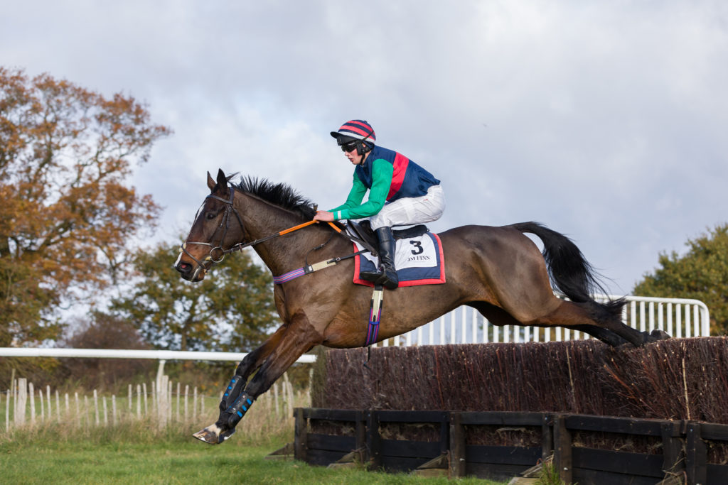 Minella Beat and Wil Featherstone jump a fence at Higham